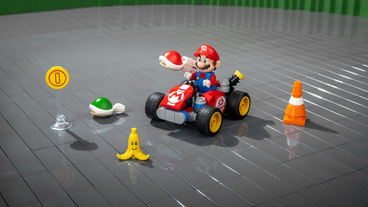 LEGO Super Mario kart set with Mario minifigure, red kart, Banana item, Green Shell, Coin marker, and traffic cone.