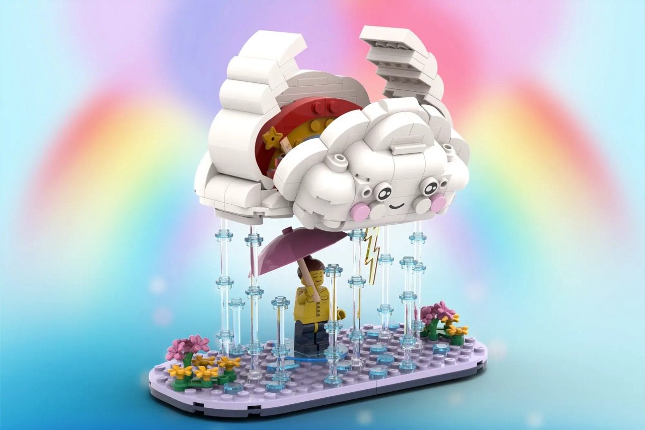 LEGO cloud set with opening design revealing rainbow inside, minifigure with umbrella, flowers, and rain elements on purpl…