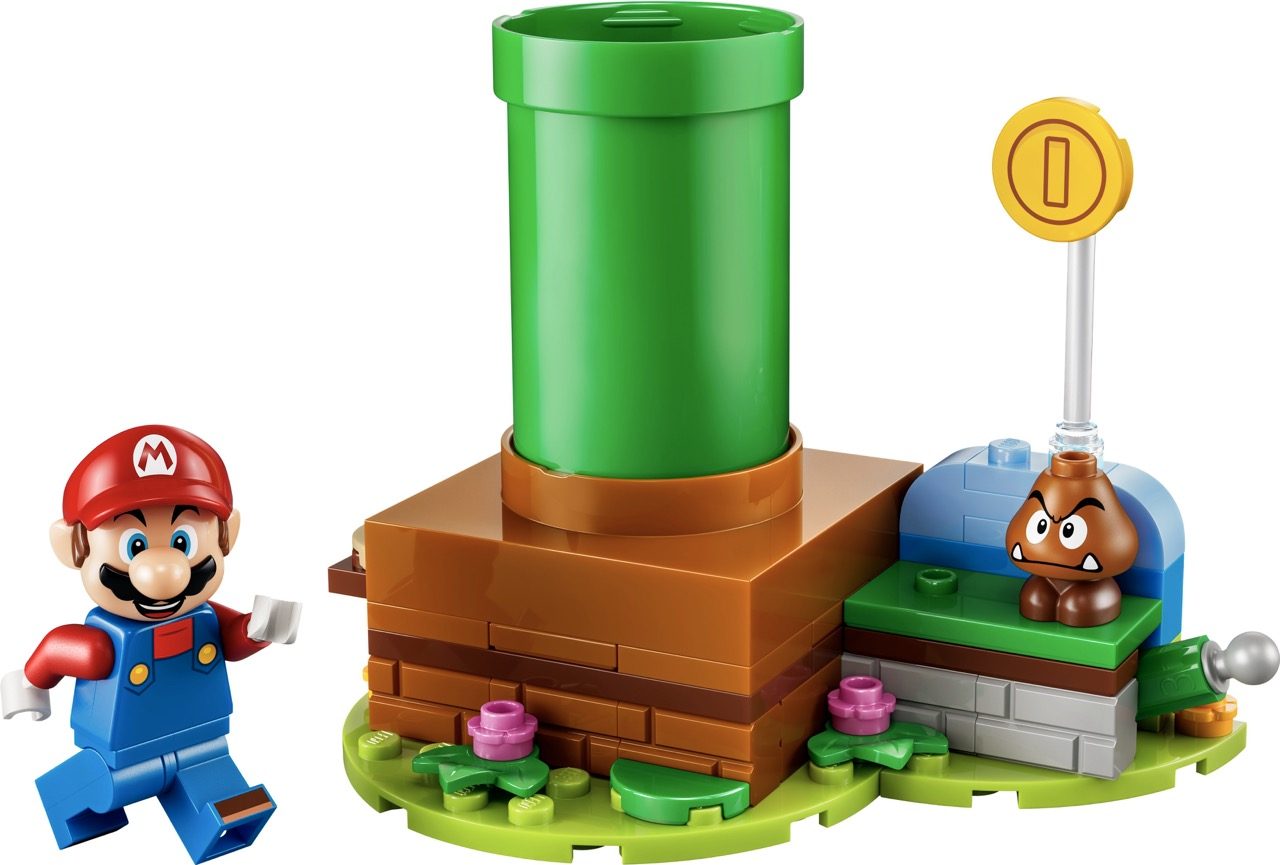 LEGO Super Mario set with Mario minifigure, green pipe, brown brick base, Goomba enemy, and gold coin flag piece.