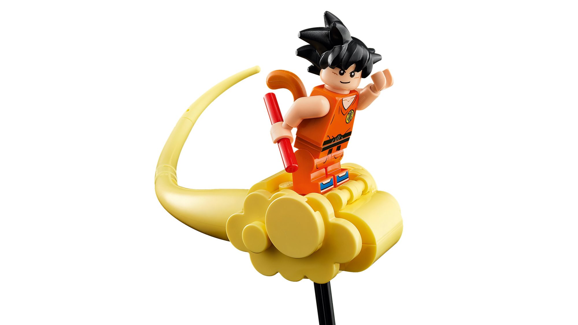 LEGO Goku minifigure riding golden Shenron's tail, holding red staff, orange gi outfit visible.