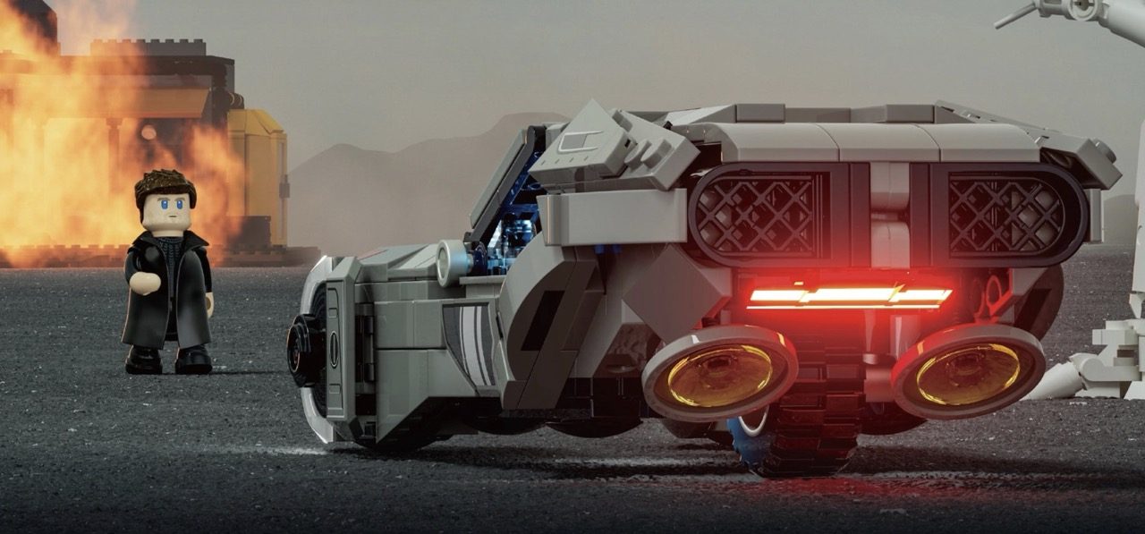 LEGO Blade Runner 2049 K's Spinner with neon lights, minifigure, and exploding building backdrop.