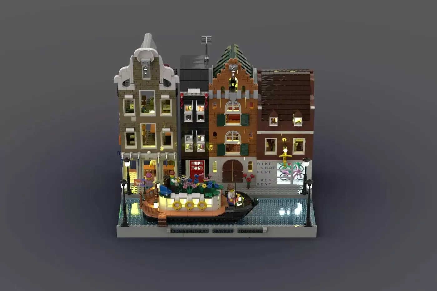 LEGO Amsterdam Canal Houses set with four detailed brick buildings, canal boat, bike shop, and minifigures on baseplate.
