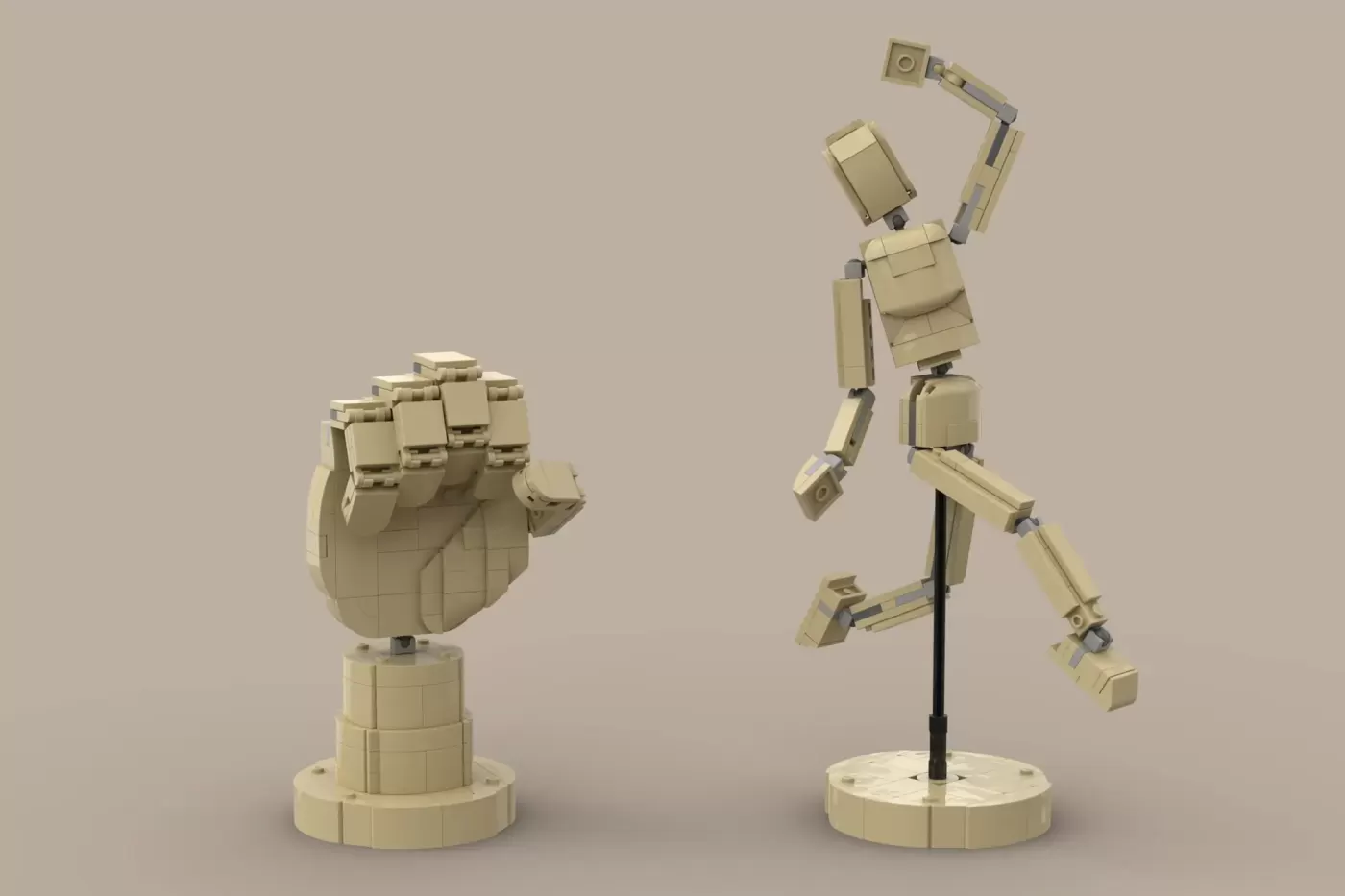 Two LEGO artistic tools: a wooden hand mannequin on a stand and an articulated artist's hand, both in tan bricks.