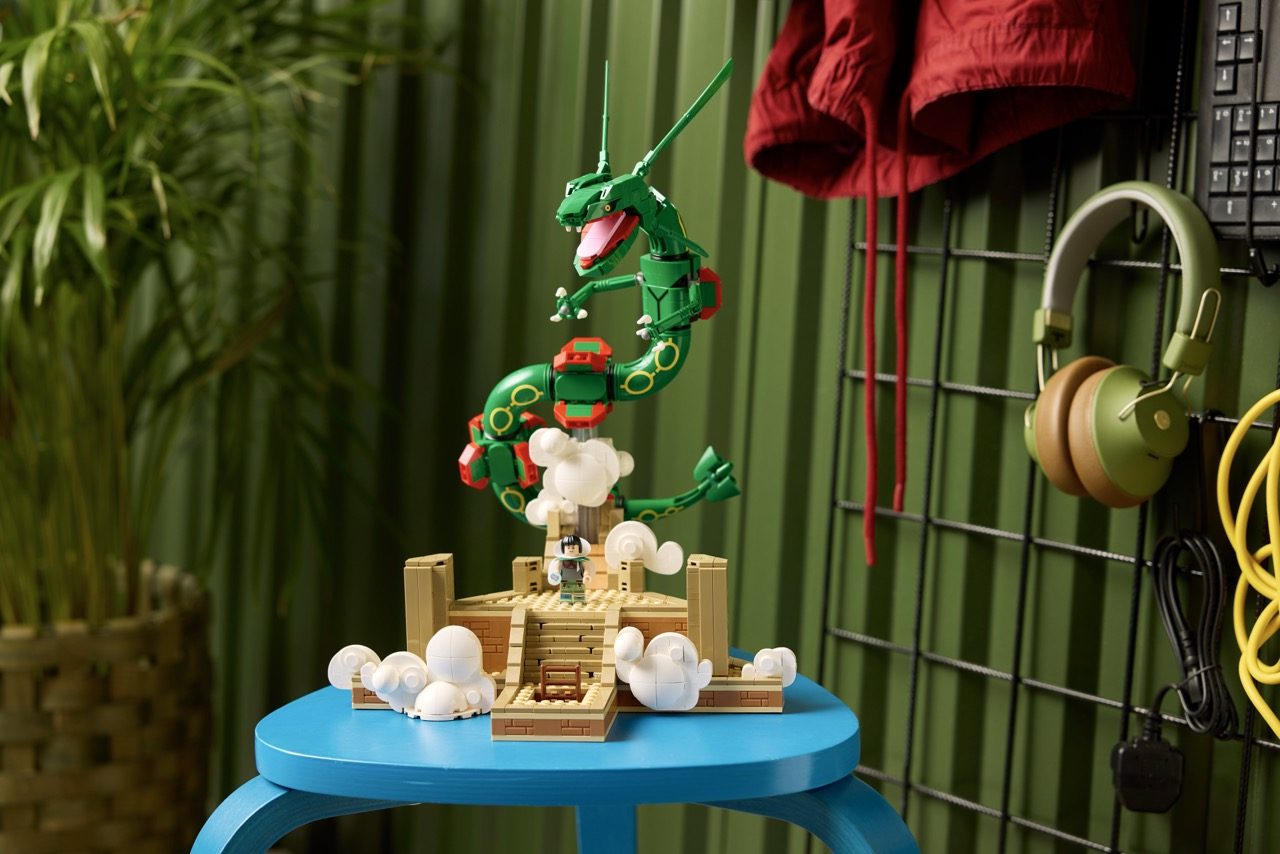 LEGO Pokémon set 72154 displayed on blue table with Rayquaza and Groudon figures above castle structure.