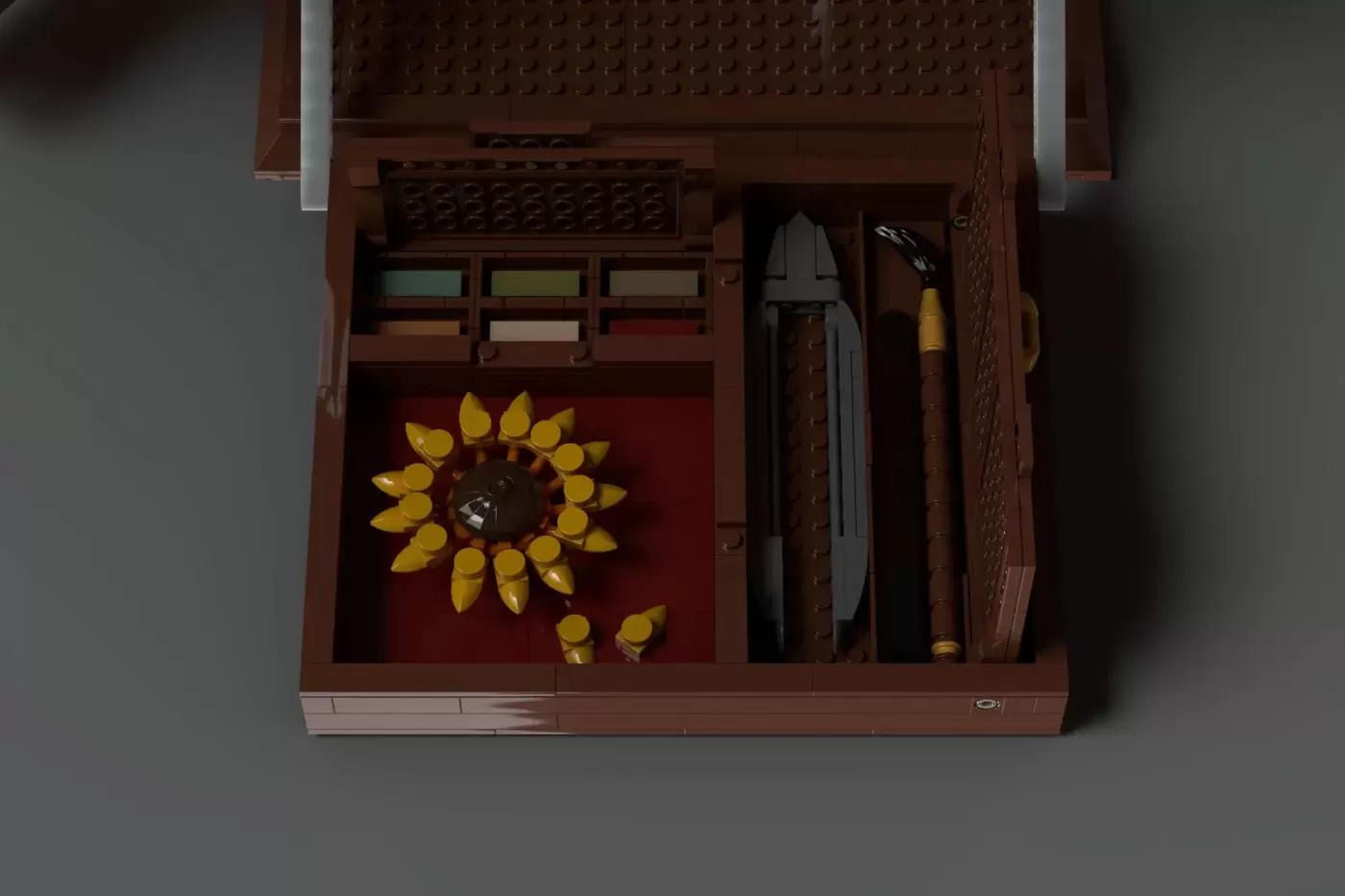 Opened LEGO botanical field kit with sunflower decoration, tools, and specimen containers on red felt display.