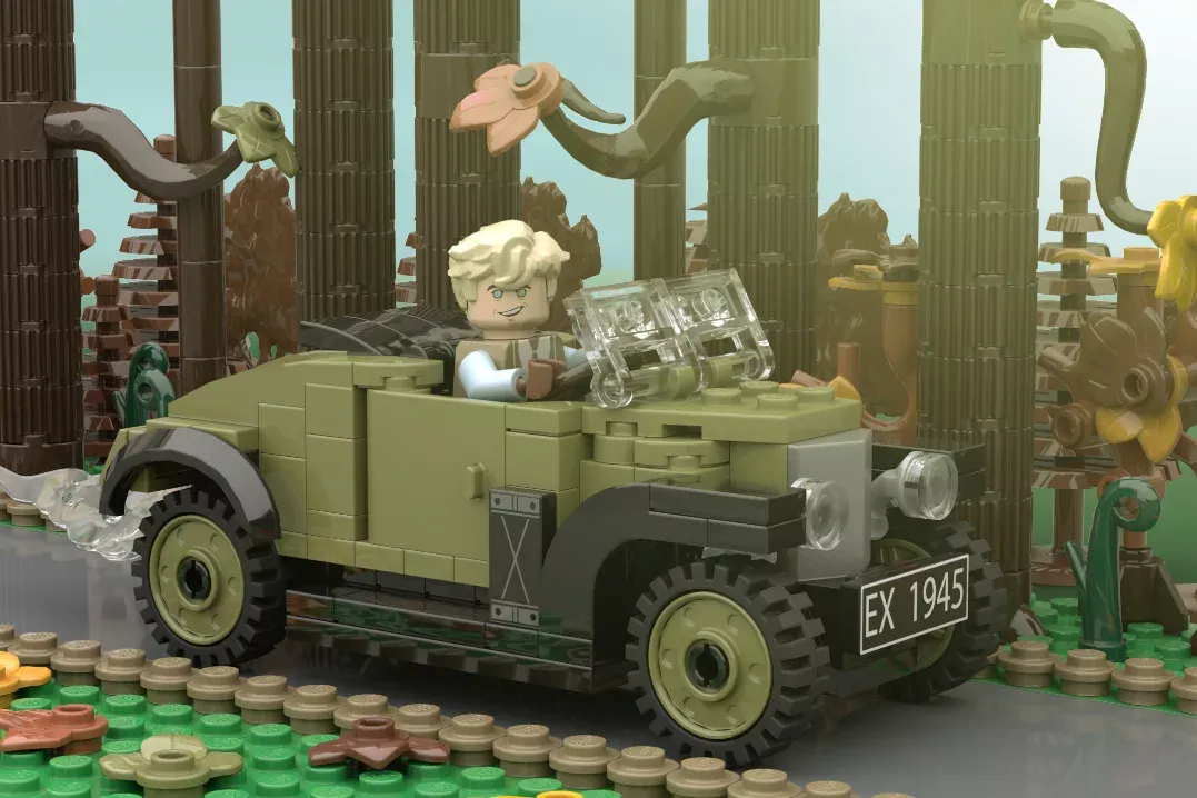 LEGO minifigure in vintage truck with license plate EX 1945, surrounded by cacti and desert scenery.