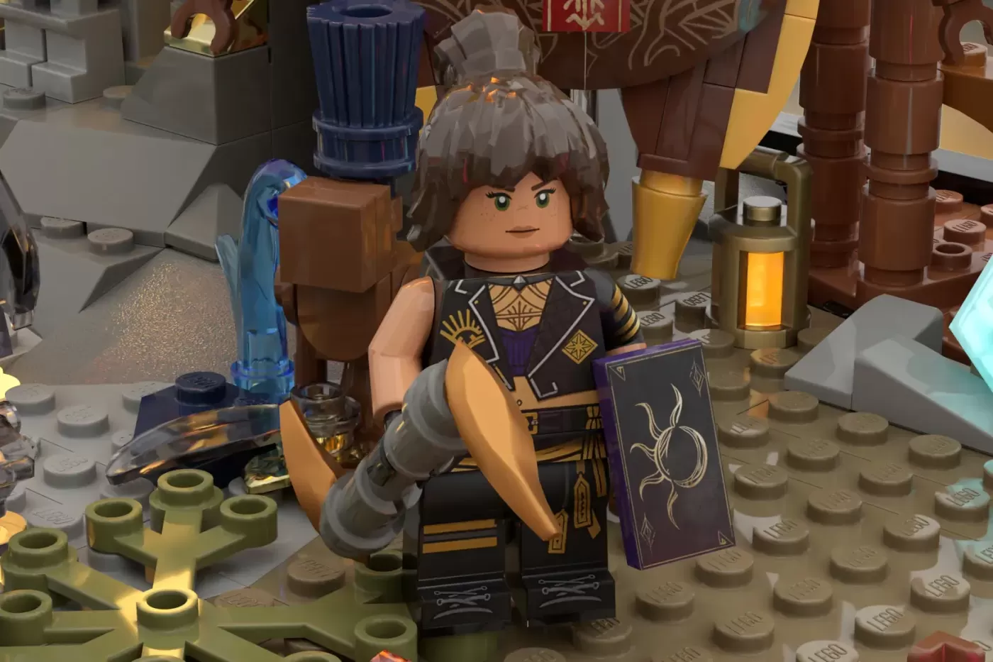 LEGO minifigure in ornate black and gold outfit holding a blue staff and purple spellbook in Belle Époque-themed set.