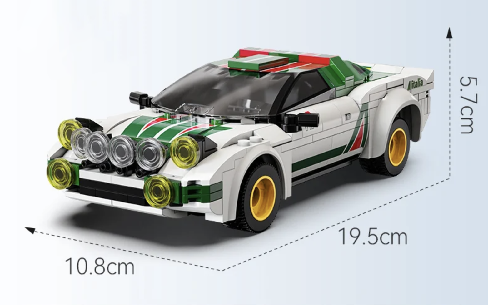 LEGO Lancia Stratos rally car with white body, green/red stripes, yellow wheels, and roof-mounted lights.