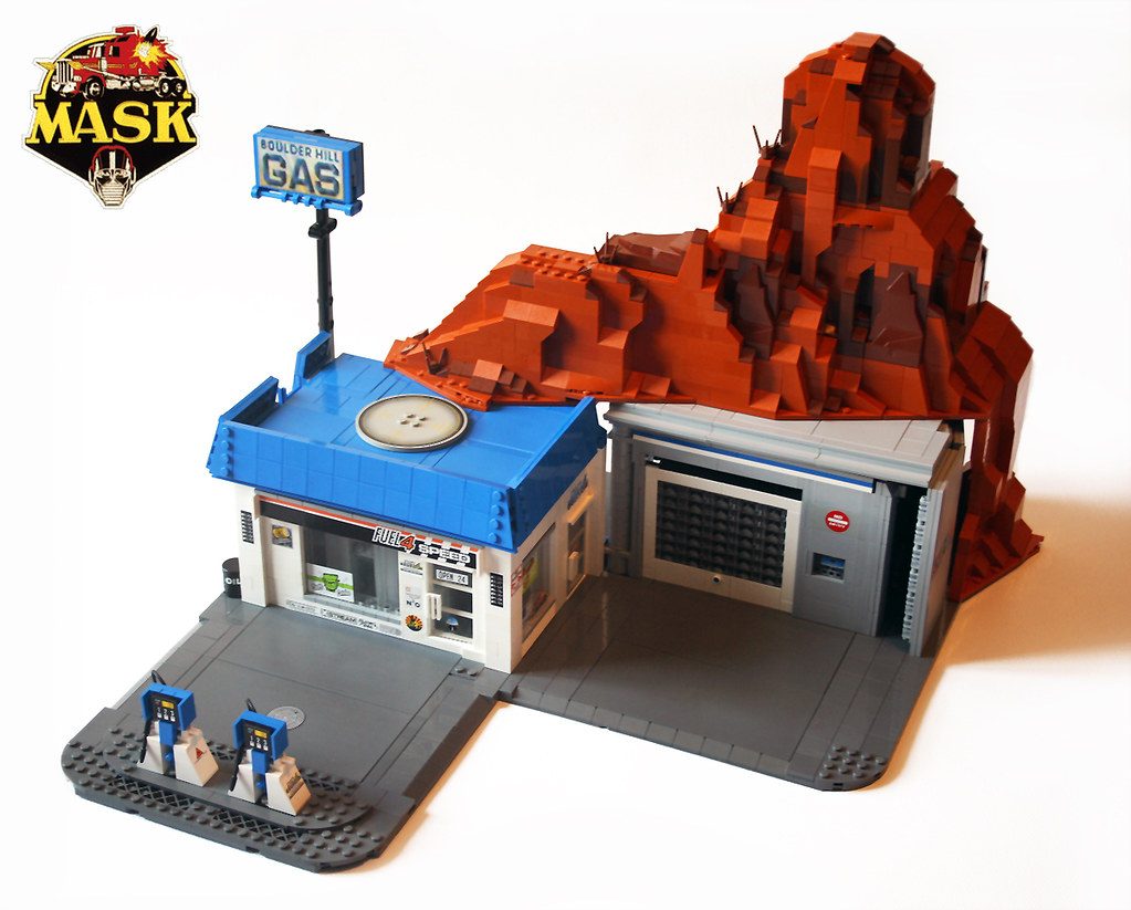 LEGO M.A.S.K. Boulder Hill base with gas station, red rock formation, and minifigures.