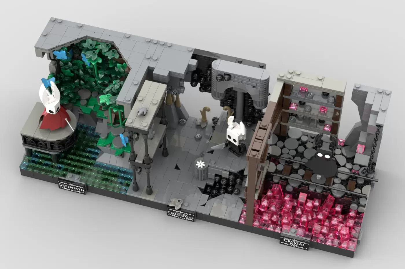 LEGO Hollow Knight diorama featuring crystalline caverns, vegetation, minifigures, and pink crystal formations across mult…