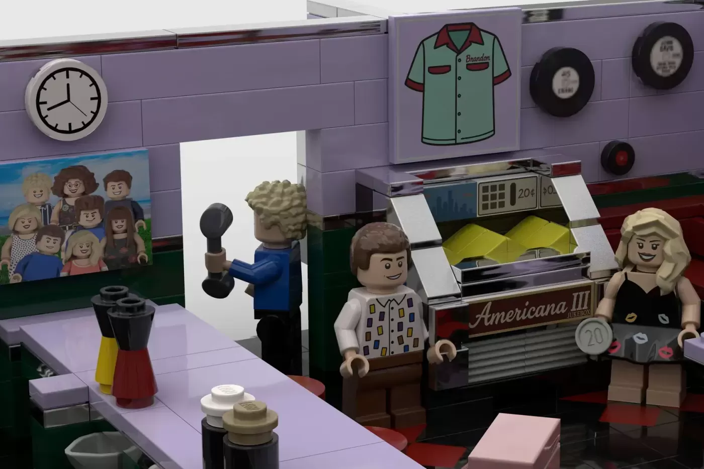 LEGO Beverly Hills 90210 Peach Pit diner set with minifigures and jukebox, featuring purple walls and retro diner details.