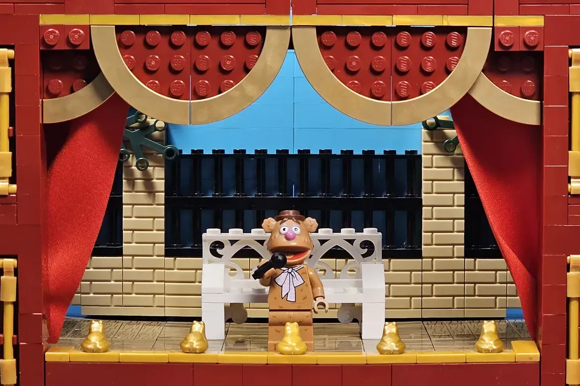 LEGO Muppet Theatre set featuring Dr. Teeth minifigure on stage with red curtains and ornate details.