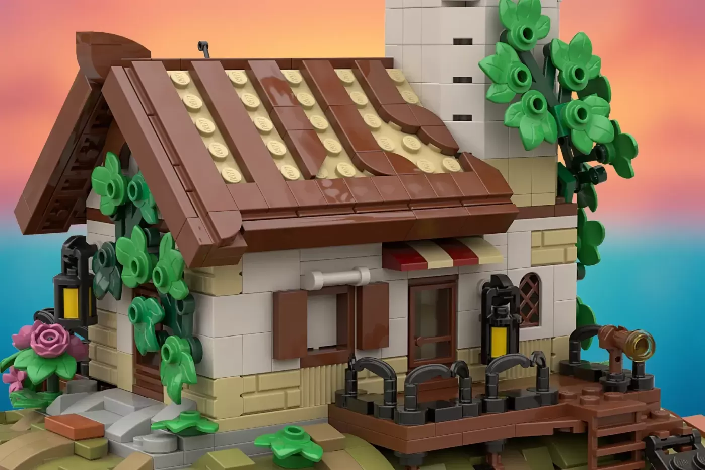 LEGO fisherman's cottage with brown roof, ivy-covered walls, dock with barrels, and colorful sky backdrop.