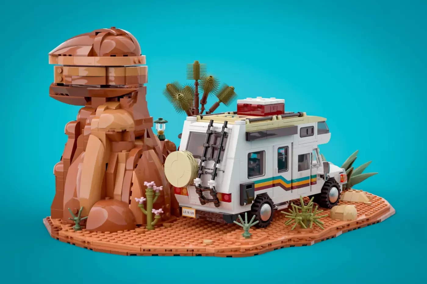 LEGO Ideas Road Trip set featuring a camper van, stone tower, and desert landscape on tan baseplate.