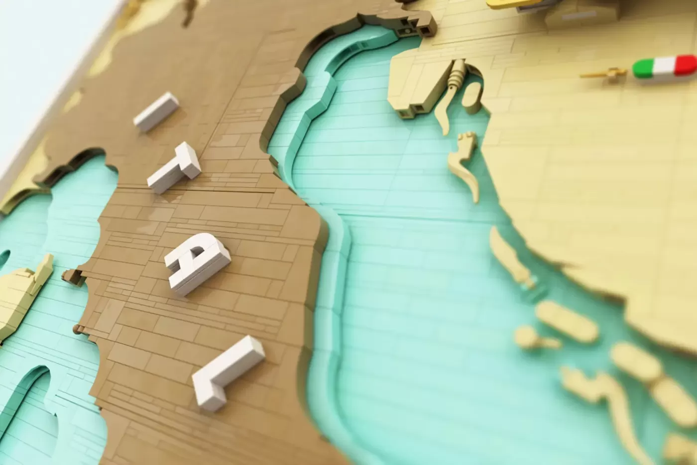 LEGO 3D map of Italy with tan brick buildings, turquoise water, and tan landmasses depicting Italian geography.