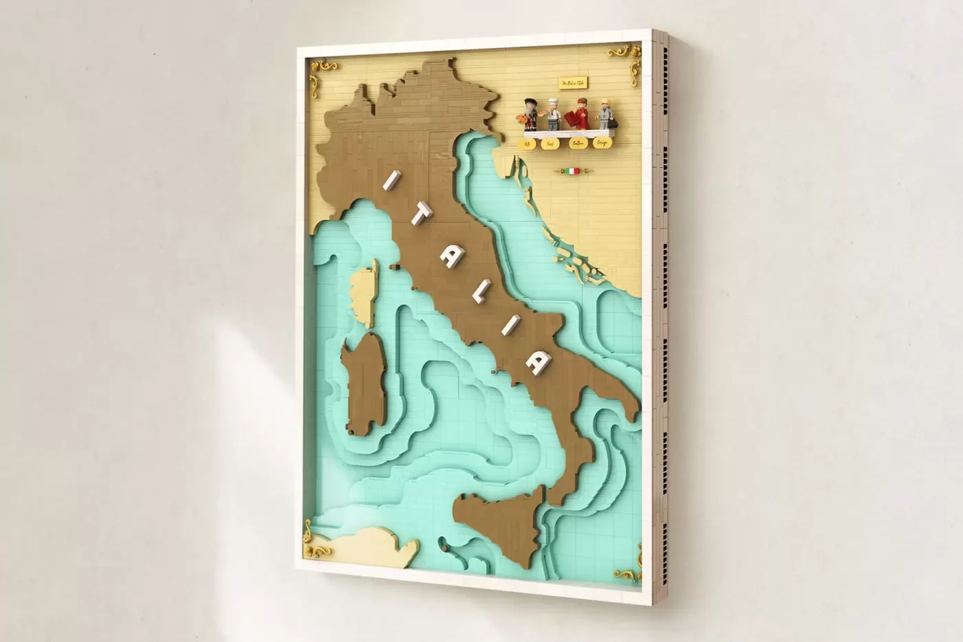 3D layered map of Italy with turquoise water, brown landmass, minifigures, and decorative elements in wooden frame.