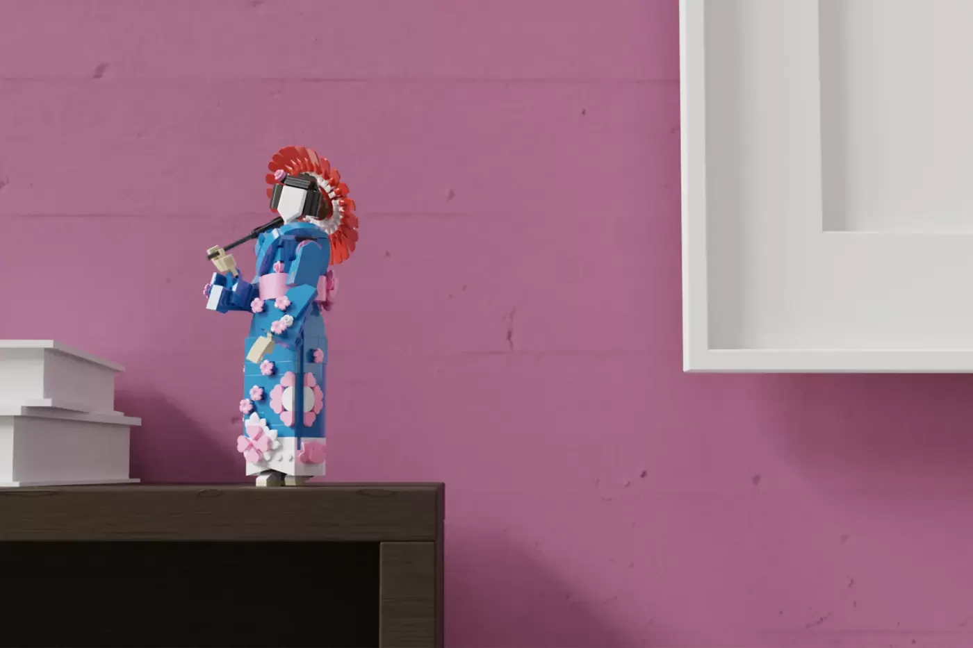 LEGO minifigure in blue kimono with pink floral details and red hair accessory standing on dark shelf against pink wall.