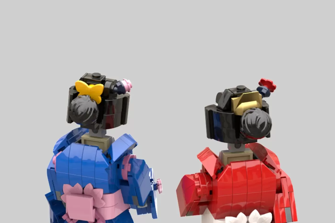 Two LEGO minifigures wearing customizable kimono outfits in blue and red with interchangeable head and torso pieces.