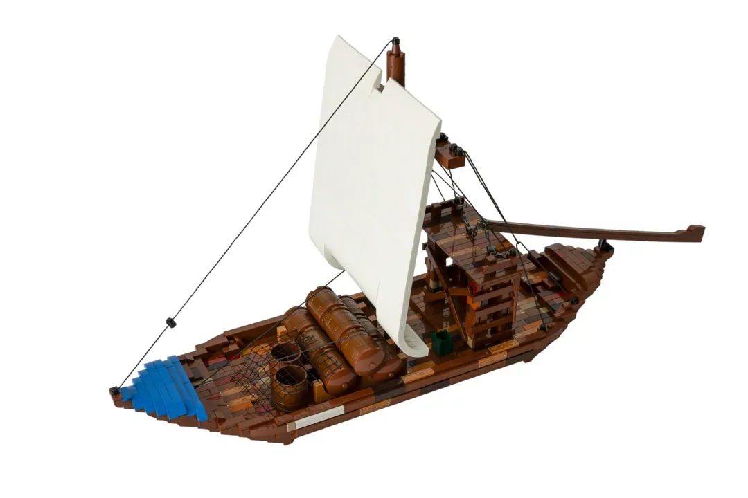 LEGO Barco Rabelo model featuring wooden hull, white sail, blue trim, barrels, and detailed rigging on white background.
