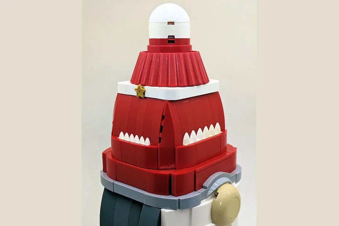 LEGO Christmas gnome with red suit, white beard, and pointed hat, approximately 30 cm tall.