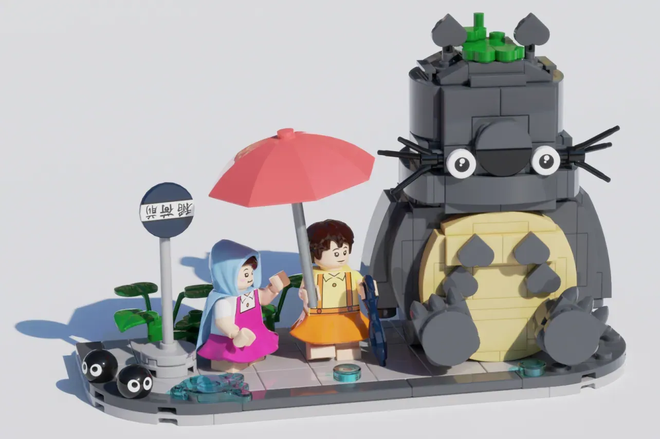 LEGO Totoro and Catbus set with minifigures, red umbrella, and detailed gray cat-shaped bus structure.