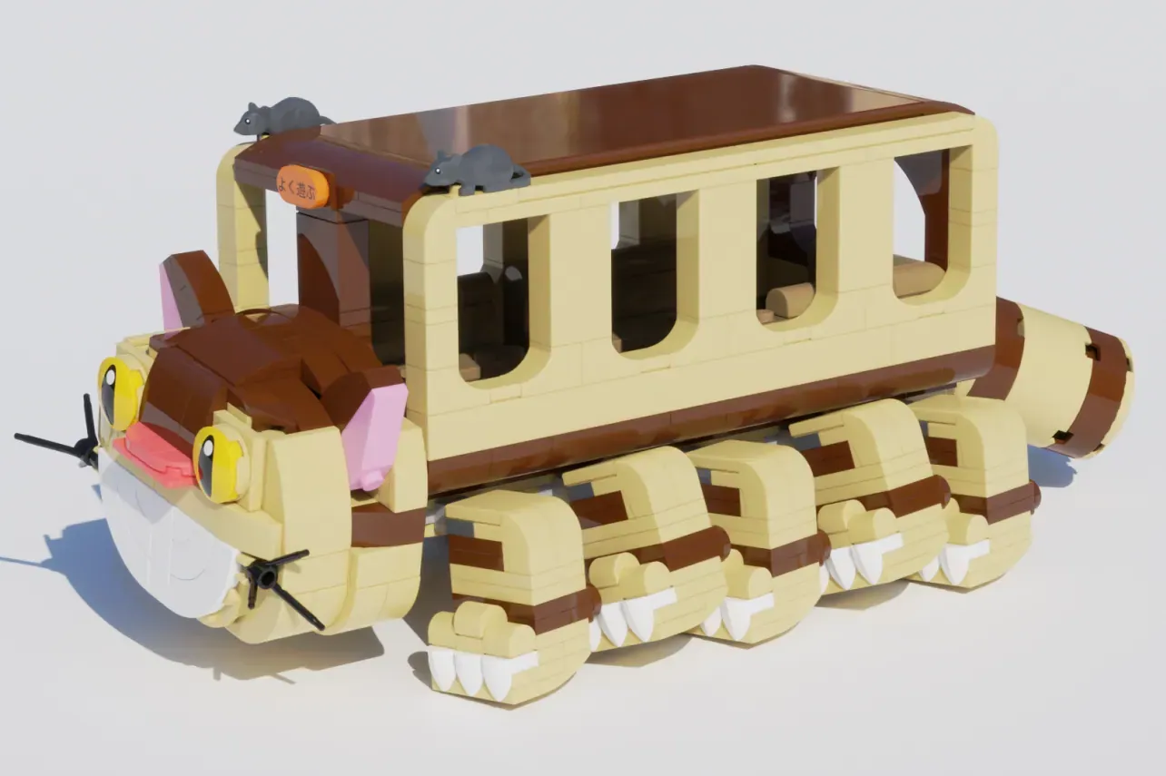 LEGO Catbus from My Neighbor Totoro with cream and brown body, large teeth wheels, and rat figurines on roof.