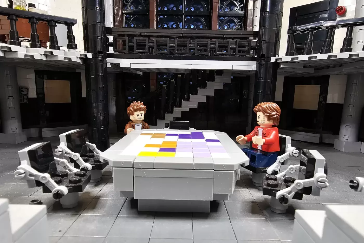 LEGO bunker interior with two minifigures at a colorful map table, flanked by robotic figures and multi-level architecture.