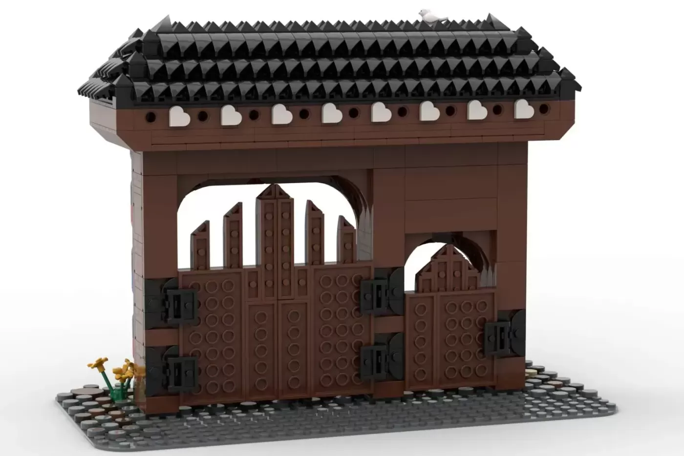 LEGO model of Szekler Gate with brown brick structure, black tiled roof, arched doorways, and decorative details on gray b…