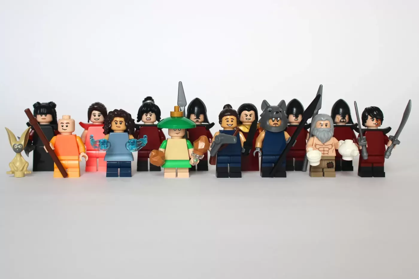 LEGO Avatar: The Last Airbender minifigures lineup featuring 15 characters including Aang, Katara, and Appa the flying bison.