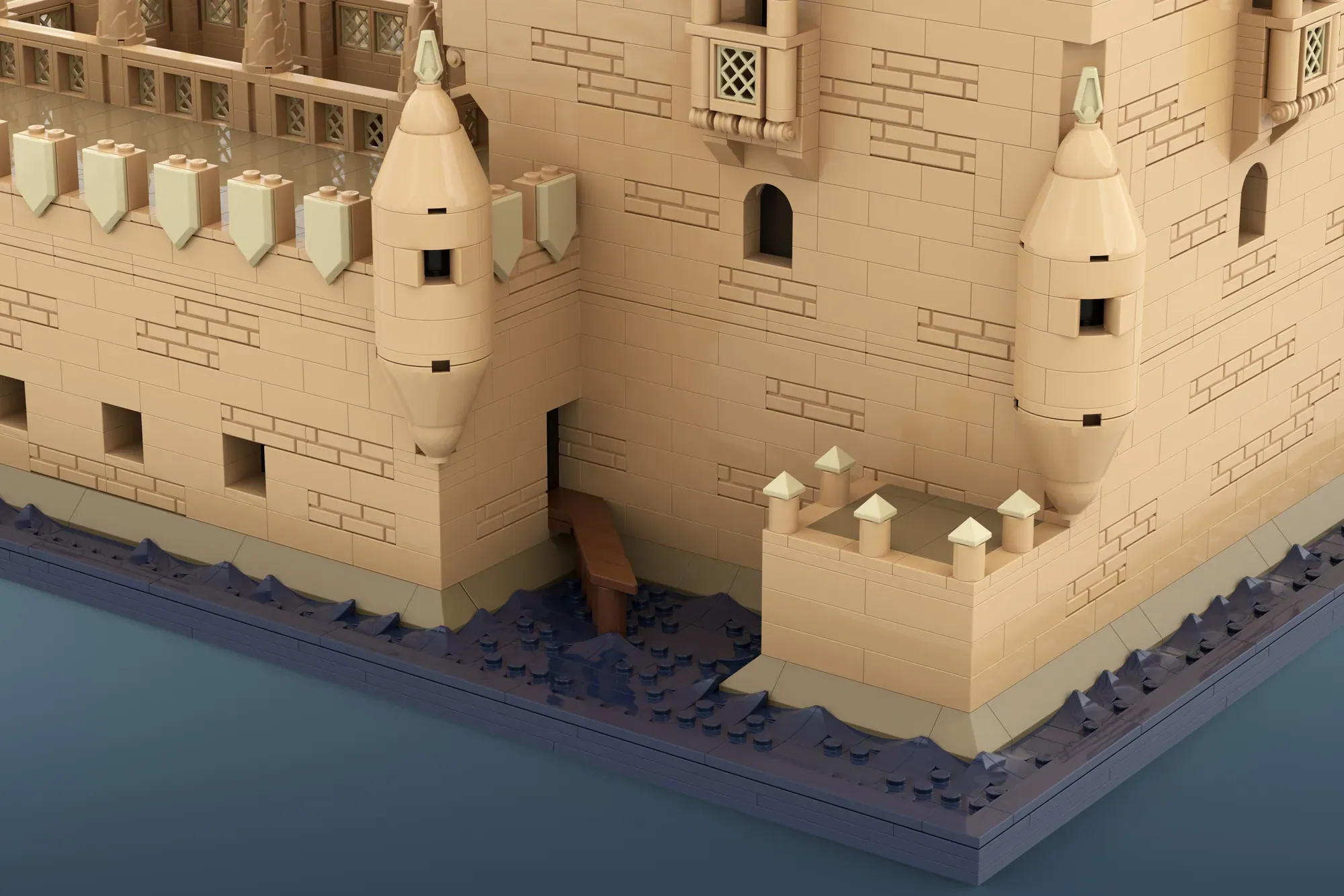 LEGO Belém Tower model showing cream-colored fortress with towers, crenellations, and water base detail.